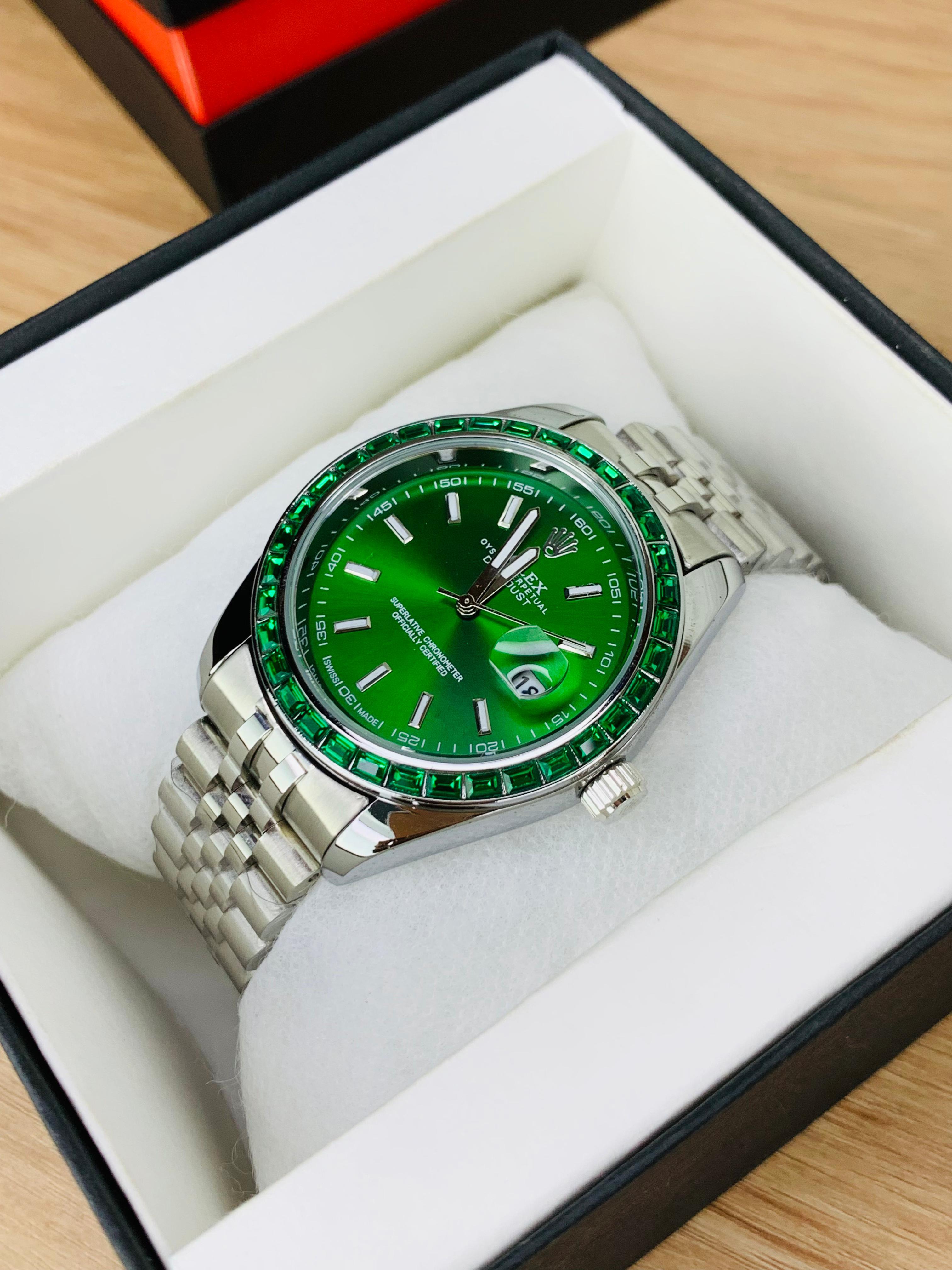  Green Close-up of Rolex Stone Dial black face with date display