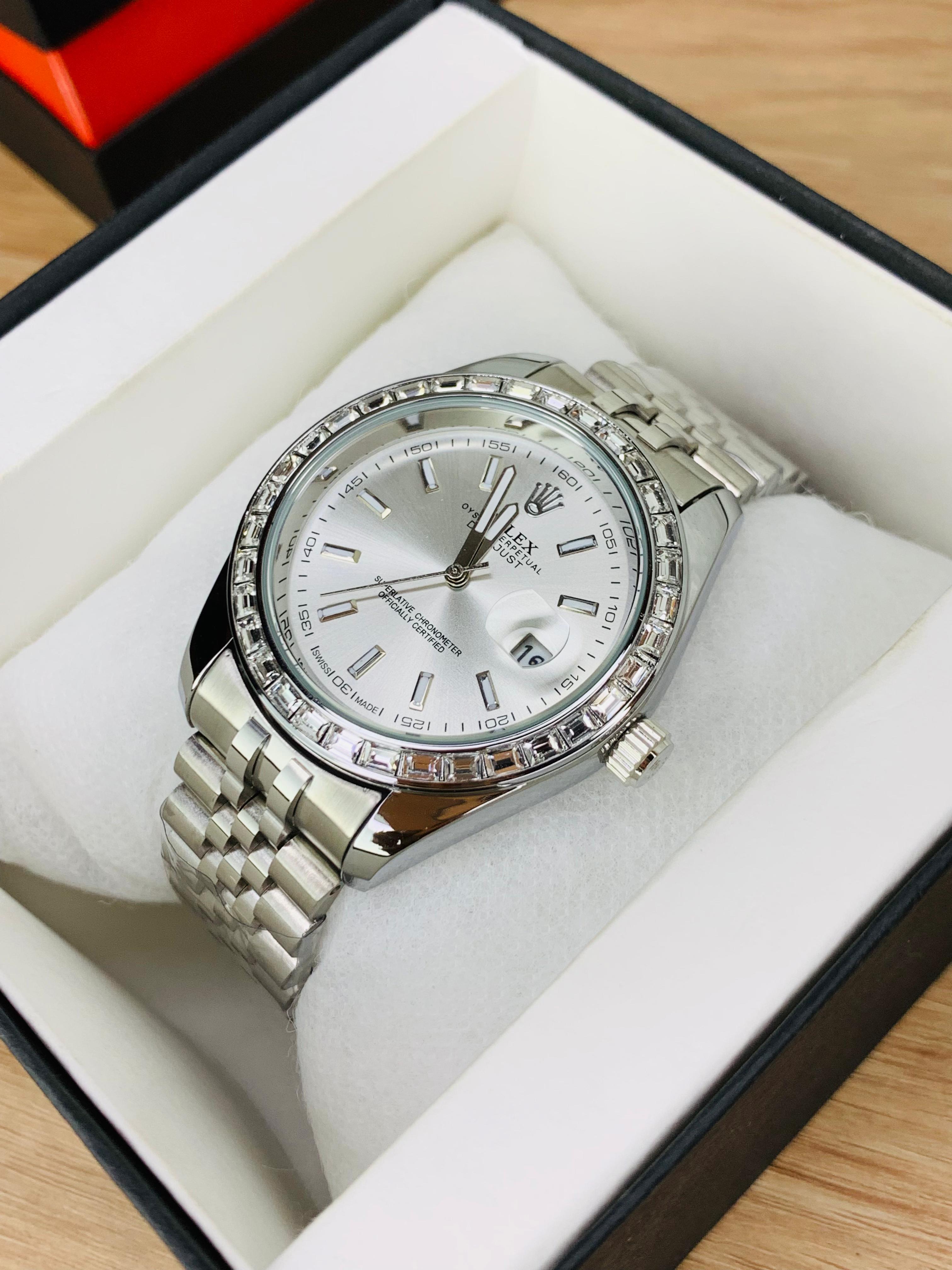  White Close-up of Rolex Stone Dial black face with date display