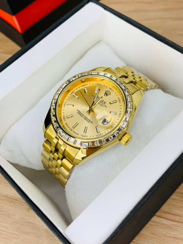 Close-up of Full Golden Stone Dial black face with date display